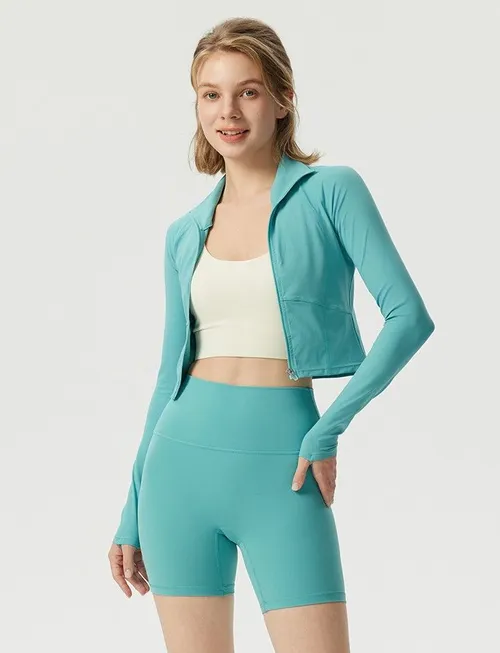 Veste de fitness pour femmes, ajustée, de couleur unie, avec surpiqûres et fermeture à glissière