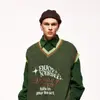Unisex svetrová vesta s kontrastním lemováním a vyšívaným nápisem Dreaming passion