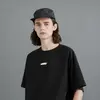 Unisex tričko s krátkým rukávem a fosforeskujícím detailem Wake na hrudníku